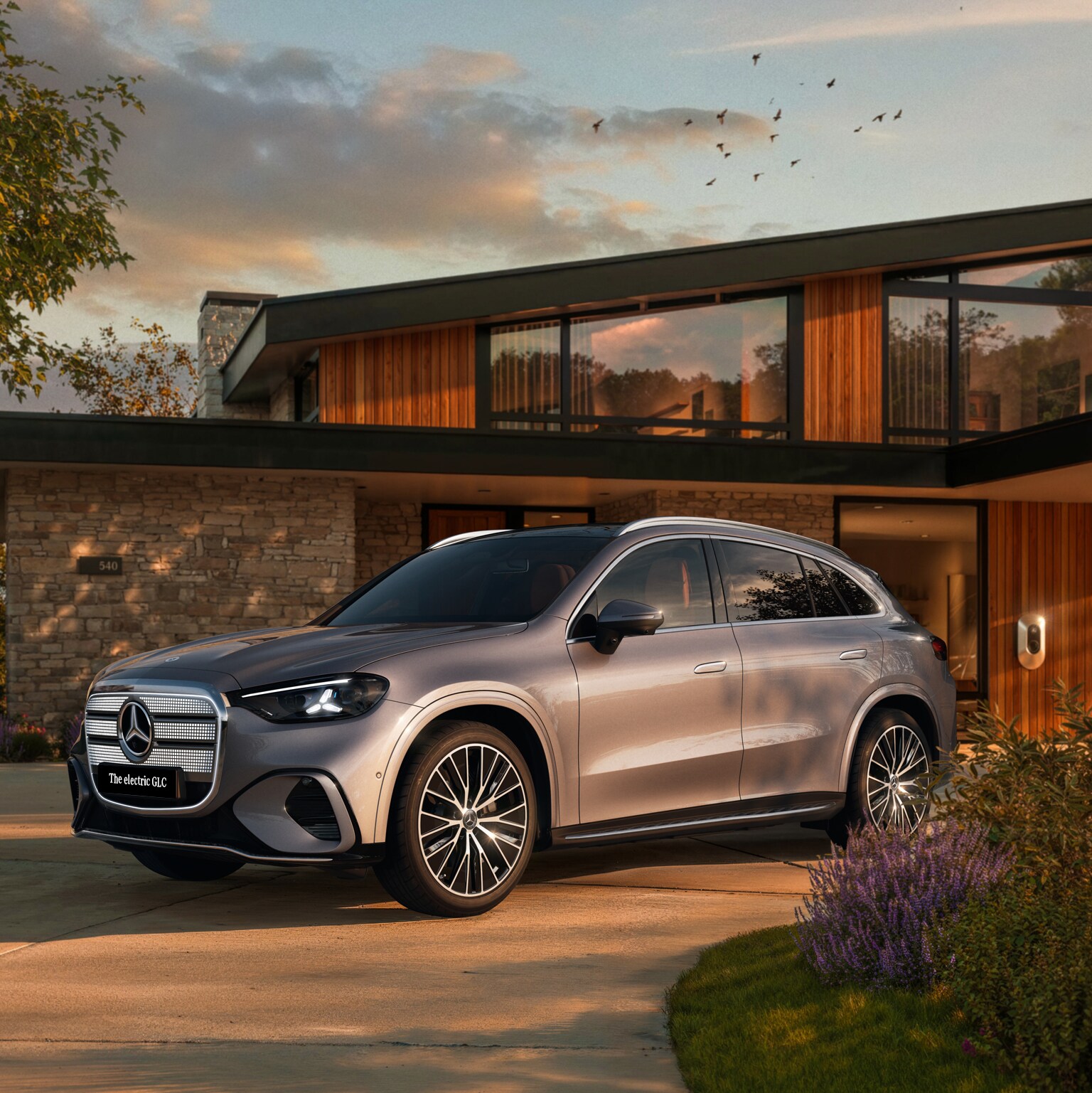 The all-new Mercedes-Benz electric GLC showcased in a modern setting, highlighting its distinctive front design and sleek exterior details.