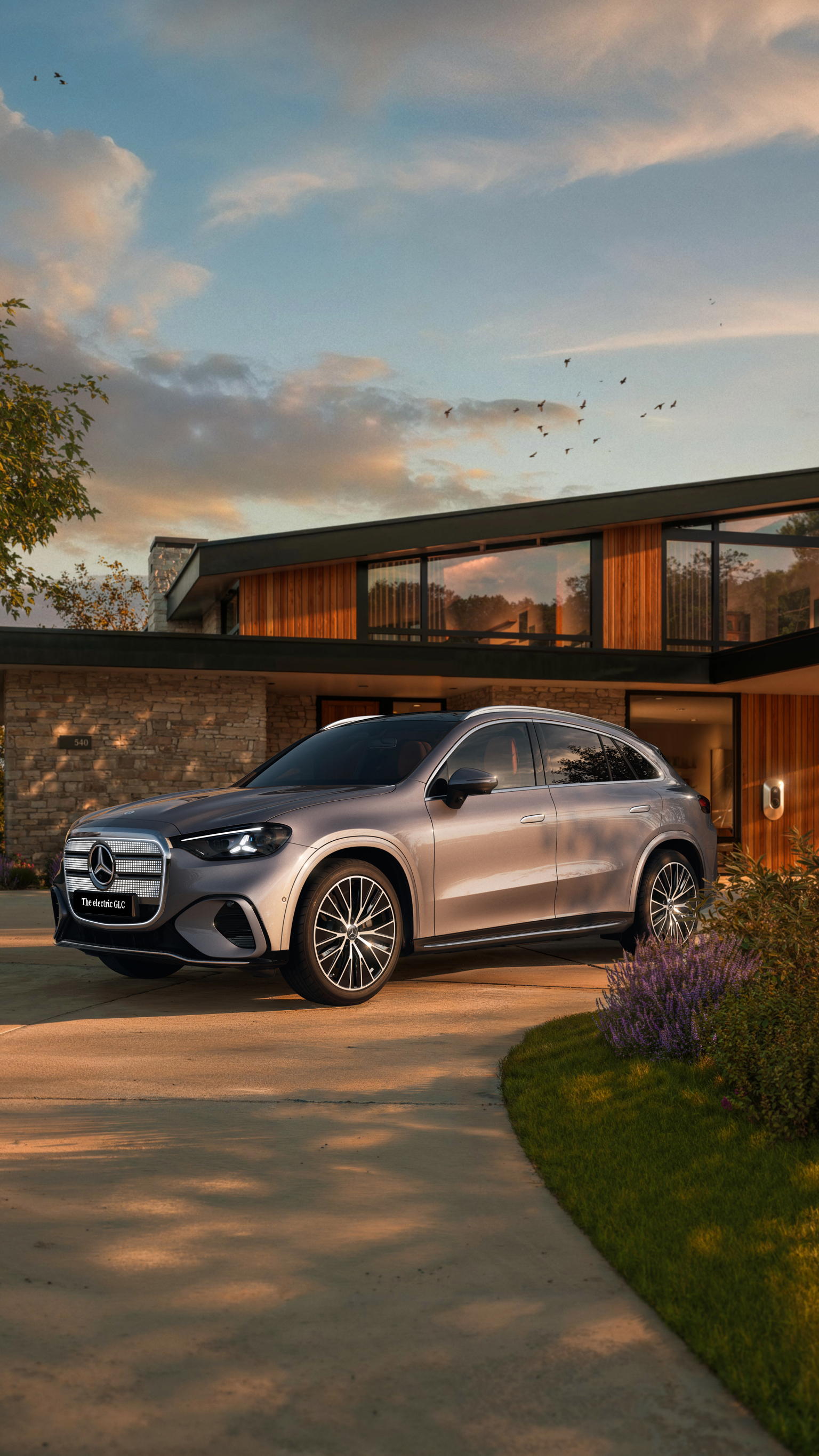 The all-new Mercedes-Benz electric GLC showcased in a modern setting, highlighting its distinctive front design and sleek exterior details.