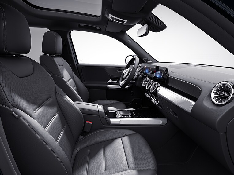 The interior of the EQB from Mercedes-EQ with AMG Line including a 3-spoke multifunction sport steering wheel in nappa leather.